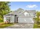 Charming single-Gathering home with a well-manicured lawn and attached two-car garage at 7511 Savannah Ln, Tampa, FL 33637