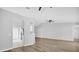 Spacious living room with modern flooring, high ceilings, and neutral paint throughout the home at 7511 Savannah Ln, Tampa, FL 33637