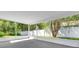 Enclosed patio with views of the private backyard and serene natural beauty at 7511 Savannah Ln, Tampa, FL 33637