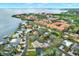 Breathtaking aerial view showcasing the waterfront condos with boat docks and tree-lined streets at 203 Driftwood W Dr, Palm Harbor, FL 34683