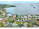 Stunning aerial view of waterfront homes, showcasing the coastal community and serene bay at 203 Driftwood W Dr, Palm Harbor, FL 34683