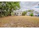 A view of the backyard, showcasing the home's exterior and surrounding greenery at 3944 11Th S Ave, St Petersburg, FL 33711