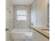 Charming bathroom featuring marble tile, granite countertop, and modern fixtures at 3944 11Th S Ave, St Petersburg, FL 33711
