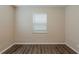 Bright bedroom features wood-look floors and natural light, perfect for relaxation at 3944 11Th S Ave, St Petersburg, FL 33711