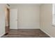 Well-lit bedroom features wood-look floors and natural light, perfect for relaxation at 3944 11Th S Ave, St Petersburg, FL 33711