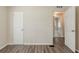Bright bedroom features wood-look floors and adjacent bathroom, offering modern comfort at 3944 11Th S Ave, St Petersburg, FL 33711
