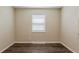 Bright bedroom features wood-look floors and natural light, creating a cozy atmosphere at 3944 11Th S Ave, St Petersburg, FL 33711