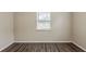 Clean bedroom featuring gray tone flooring, and a large window at 3944 11Th S Ave, St Petersburg, FL 33711