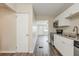 Open kitchen with stainless steel appliances, granite countertops and view to entry at 3944 11Th S Ave, St Petersburg, FL 33711