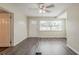 Bright living room featuring gray tone flooring, a ceiling fan and large windows at 3944 11Th S Ave, St Petersburg, FL 33711