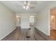 Neutral living room featuring new gray tone flooring, modern ceiling fan and two entries at 3944 11Th S Ave, St Petersburg, FL 33711