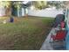 Large backyard with storage shed and white vinyl fence at 6718 Runningwoods Dr, Tampa, FL 33634
