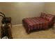 Small bedroom with neutral walls and tile floors at 6718 Runningwoods Dr, Tampa, FL 33634