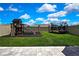 Backyard featuring a playset with slide and climbing wall plus a trampoline at 9188 Forge Breeze Loop, Wesley Chapel, FL 33545