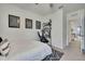 Comfortable bedroom with single bed, desk, ceiling fan, and simple decor at 9188 Forge Breeze Loop, Wesley Chapel, FL 33545