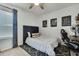 Cozy bedroom with single bed, desk, ceiling fan, and natural light at 9188 Forge Breeze Loop, Wesley Chapel, FL 33545