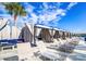 Luxury poolside cabanas with lounge seating, providing a relaxing retreat with shade and comfort at 9188 Forge Breeze Loop, Wesley Chapel, FL 33545