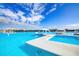 Expansive lagoon view with floating platforms, lounge seating and views of surrounding homes at 9188 Forge Breeze Loop, Wesley Chapel, FL 33545