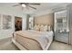 Inviting main bedroom with walk-in closet, soft textures, and ample natural light at 9188 Forge Breeze Loop, Wesley Chapel, FL 33545
