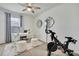 Bright office space featuring neutral walls, modern computer equipment, and exercise bicycle at 9188 Forge Breeze Loop, Wesley Chapel, FL 33545