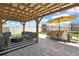 Outdoor patio area with full dining, seating and playset in the backyard at 9188 Forge Breeze Loop, Wesley Chapel, FL 33545