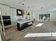 Open-concept kitchen with an island, a fireplace, and a sliding glass door to the backyard at 2309 S Ardson Pl # 1, Tampa, FL 33629