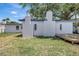 Backyard featuring a wooden deck and white exterior at 4928 Stolls Ave, Tampa, FL 33615