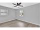Bright bedroom with newer floors, windows, and neutral paint at 4928 Stolls Ave, Tampa, FL 33615