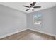 Bedroom with new floors, neutral walls, and natural light from the window, creating a cozy feel at 4928 Stolls Ave, Tampa, FL 33615