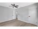 Spacious bedroom with light colored floors and ceiling fan at 4928 Stolls Ave, Tampa, FL 33615