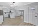 Open-concept kitchen and living area with modern appliances and sleek cabinetry at 4928 Stolls Ave, Tampa, FL 33615