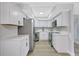 Well-equipped kitchen with stainless steel appliances, sleek countertops, and ample cabinet space at 4928 Stolls Ave, Tampa, FL 33615