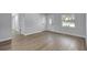 Bright and airy living space showcasing modern flooring and neutral paint at 4928 Stolls Ave, Tampa, FL 33615