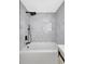 Modern bath with black shower fixtures and patterned gray tile at 4928 Stolls Ave, Tampa, FL 33615