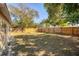 Large, grassy backyard enclosed by a wooden fence, offering a private outdoor space at 6940 82Nd N Ave, Pinellas Park, FL 33781