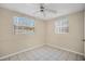 Cozy bedroom featuring tile floors and windows for natural light at 6940 82Nd N Ave, Pinellas Park, FL 33781