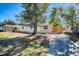 Single-story home with a well-maintained lawn, driveway, and secure wooden fence at 6940 82Nd N Ave, Pinellas Park, FL 33781