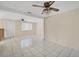 Bright living room featuring tile floors and a ceiling fan at 6940 82Nd N Ave, Pinellas Park, FL 33781