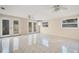 Large living area featuring tile floors and access to the backyard at 6940 82Nd N Ave, Pinellas Park, FL 33781