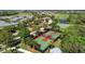 Aerial view of community tennis and basketball courts surrounded by mature trees and lush greenery at 1031 Signet, Apollo Beach, FL 33572
