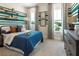 Stylish bedroom featuring a baseball theme, striped walls, and comfortable blue bedding and pillows at 1031 Signet, Apollo Beach, FL 33572
