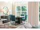 Bright dining area with a round table, four chairs, and a large window offering a view of the outdoors at 1031 Signet, Apollo Beach, FL 33572