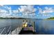 Community dock with kayaks and a serene lake view under a beautiful blue sky at 1031 Signet, Apollo Beach, FL 33572