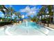 Resort-style community pool area with splash features, tropical landscaping, and inviting atmosphere at 1031 Signet, Apollo Beach, FL 33572