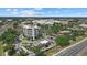 Aerial shot capturing the building, commercial spaces, and landscape in the surrounding neighborhood at 2682 Edwin Ave, North Port, FL 34288