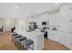 Modern kitchen with white cabinets, stainless steel appliances, a center island with barstool seating at 2682 Edwin Ave, North Port, FL 34288