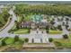 Stunning aerial view of the clubhouse with a pool and well-manicured landscaping in a desirable community at 29043 Picana Ln, Wesley Chapel, FL 33543