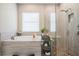 Elegant bathroom featuring a soaking tub, a frameless glass shower, and modern fixtures at 29043 Picana Ln, Wesley Chapel, FL 33543