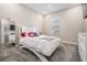 This bedroom boasts a large window, carpeted floor, and cute decor at 29043 Picana Ln, Wesley Chapel, FL 33543