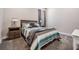 Cozy bedroom with a comfortable bed, bedside tables, soft carpet, and a window with curtains at 29043 Picana Ln, Wesley Chapel, FL 33543
